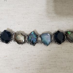 Blue shades and silver bracelet